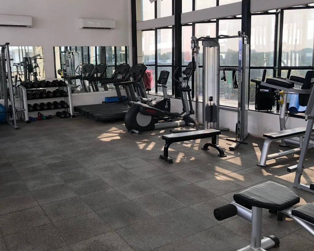 The clubhouse gym with cardio and weight machines