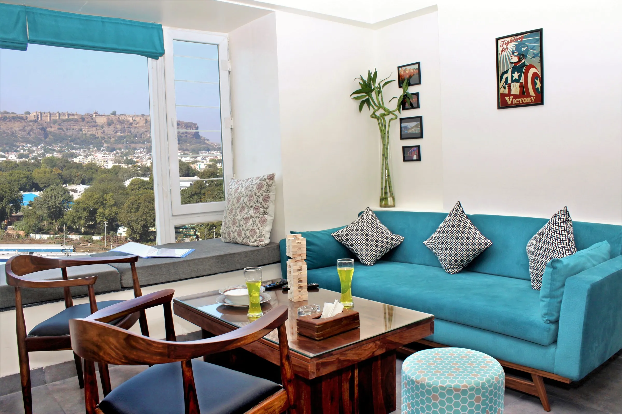 Living room of a furnished home with a view of Gwalior Fort