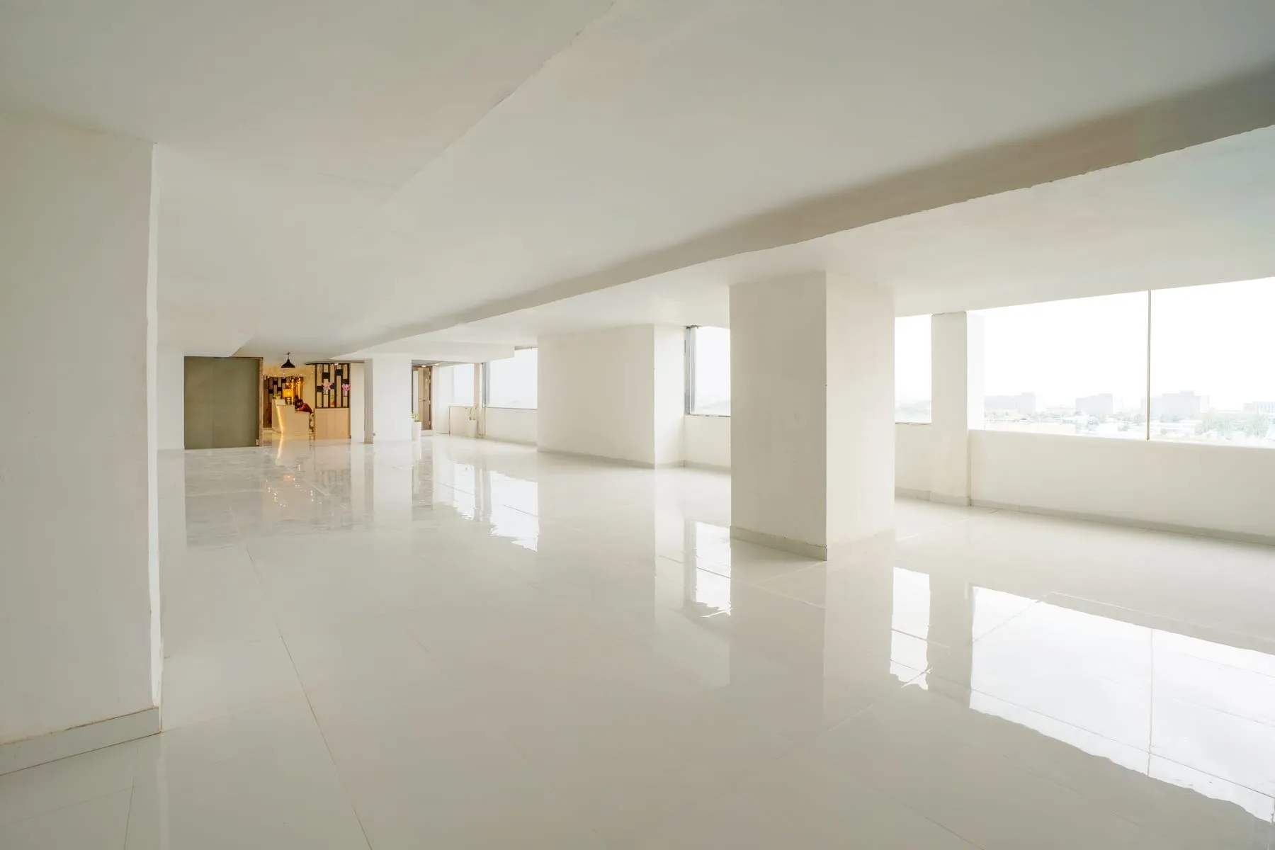 Bare-shell office with diagonal window wall