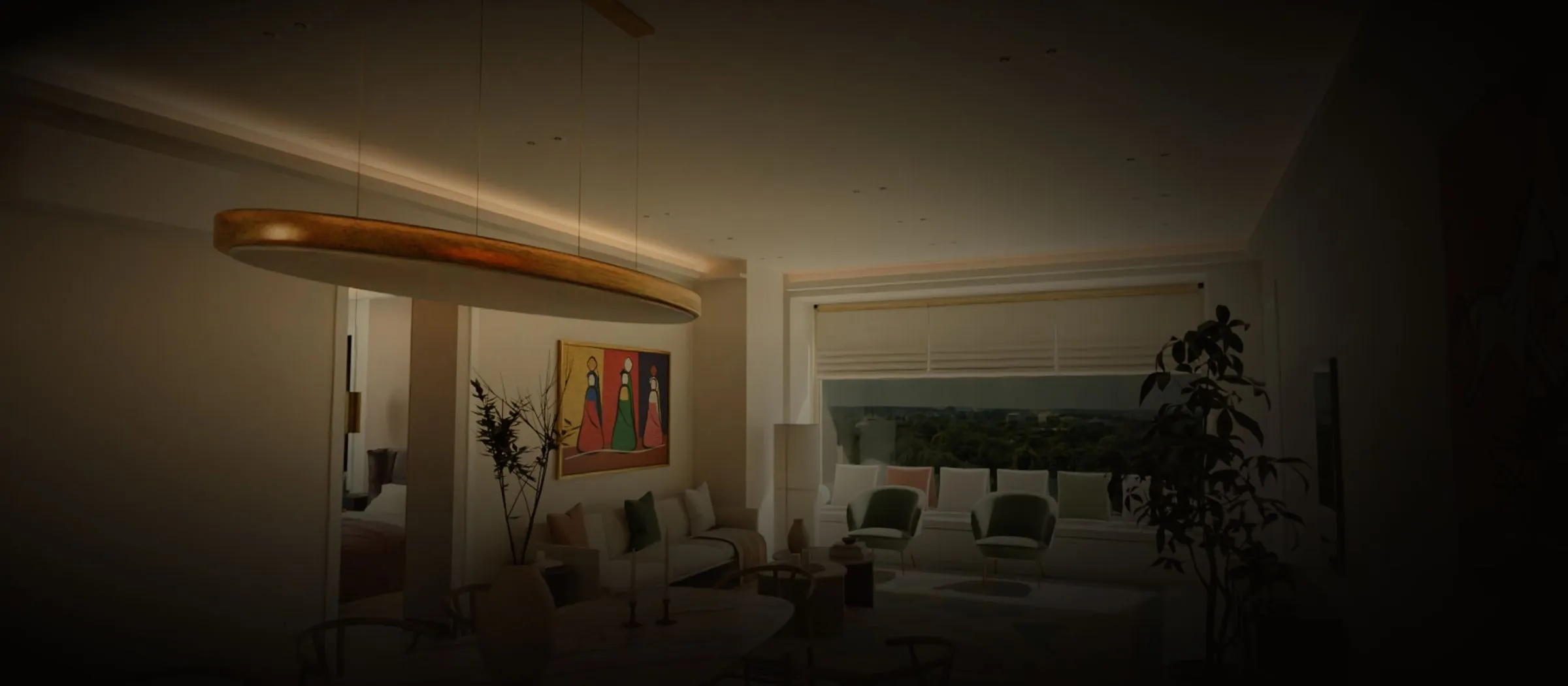 A glimpse of a Keshar Towers 2 living room at dusk: warm ceiling light and a wide window onto the trees, the rest in shadow