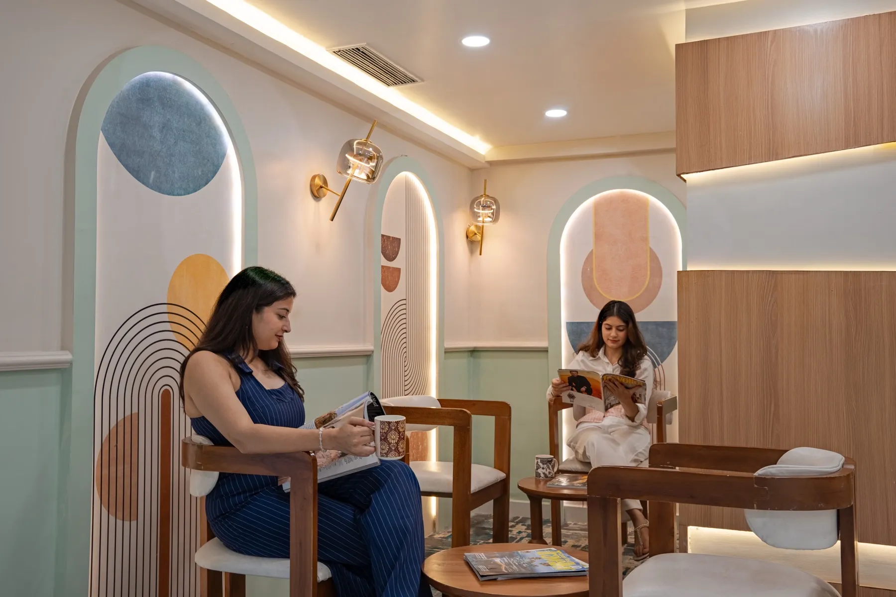 Two people reading in the MileStone lounge