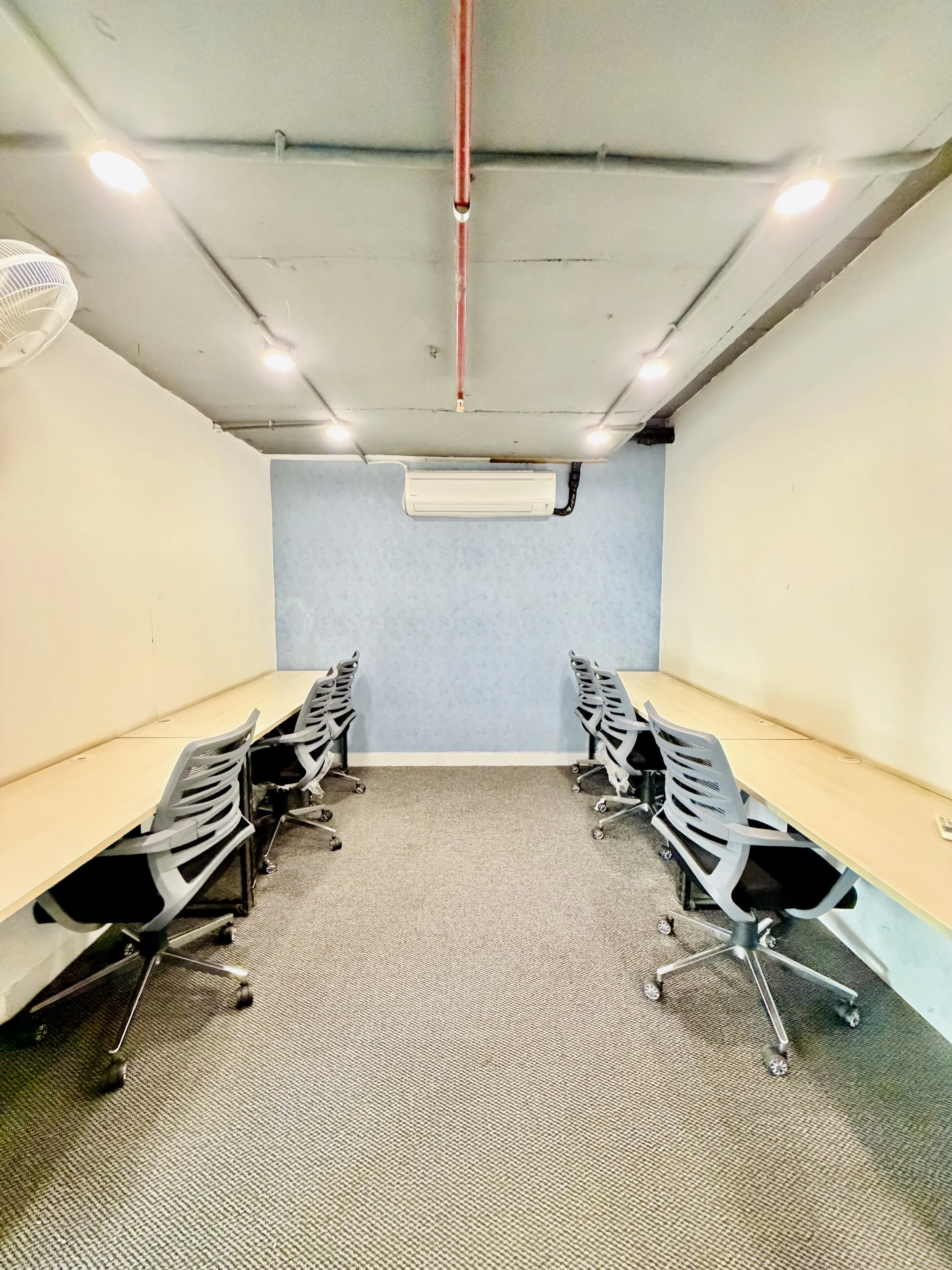 Open desks in the shared coworking area