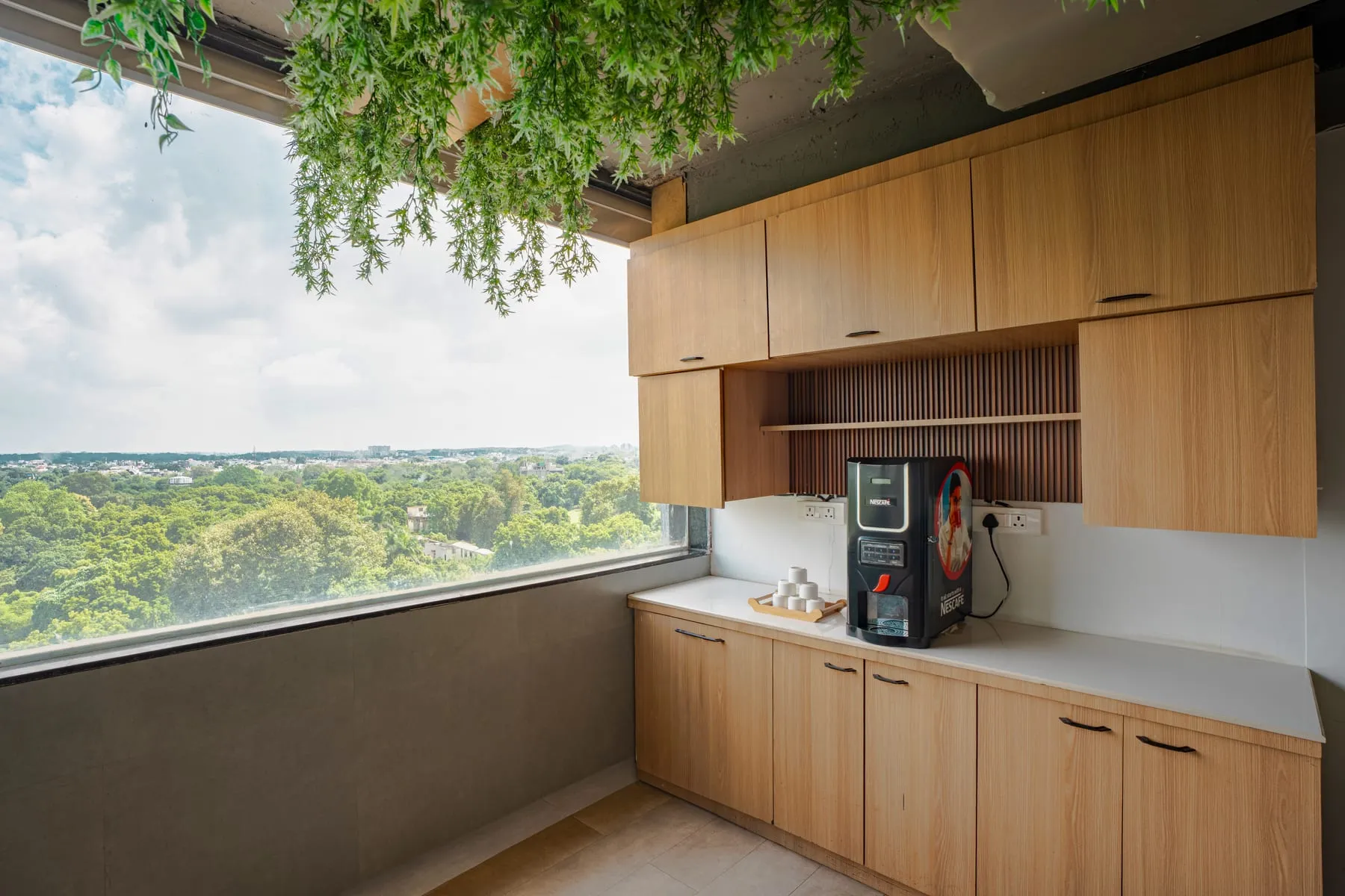 Pantry counter with coffee machine and window view