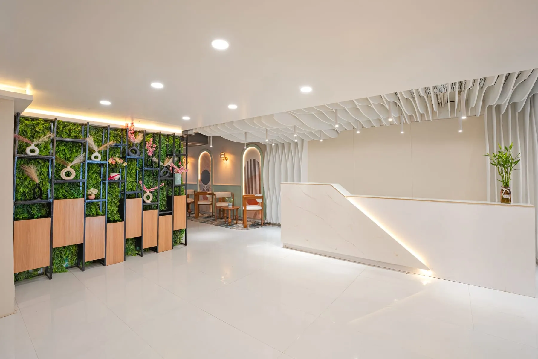 Reception desk with green wall at MileStone